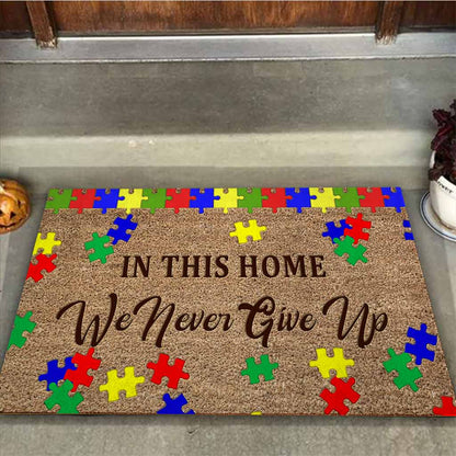 In This Home We Never Give Up - Autism Awareness Coir Pattern Print Doormat